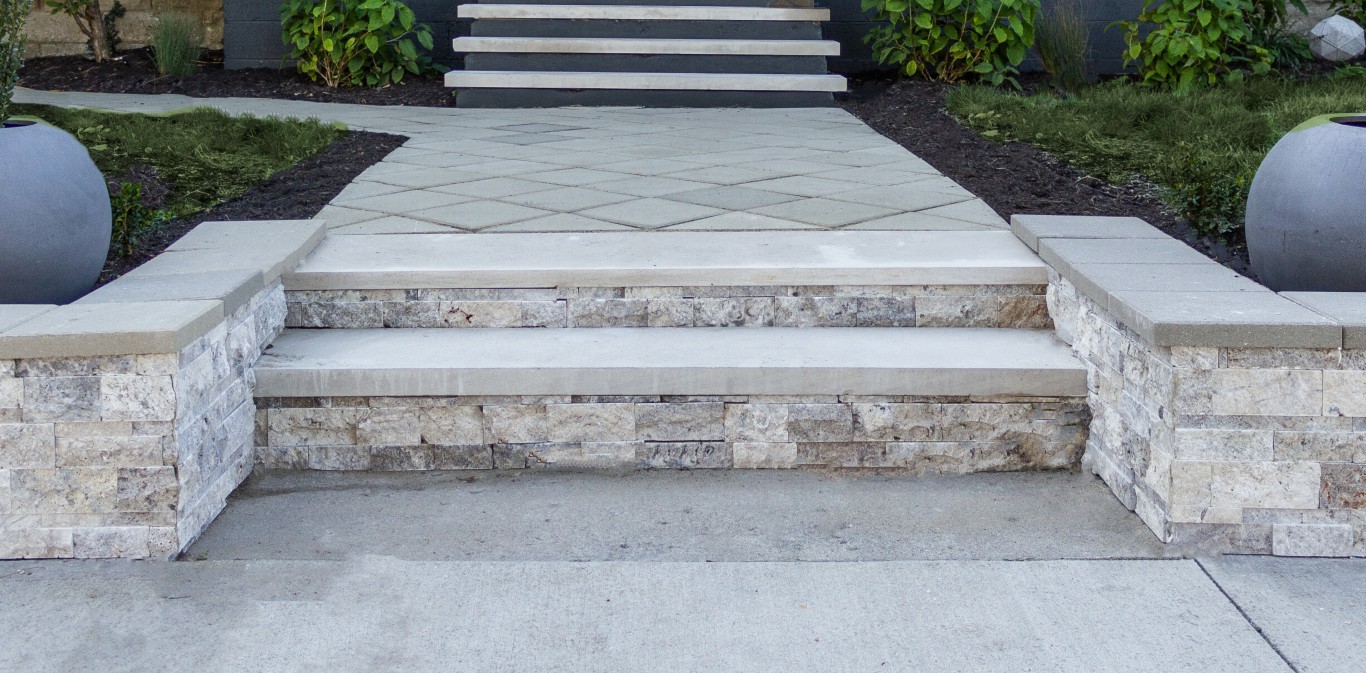 Professional concrete steps with decorative masonry retaining walls in Hutchinson, KS